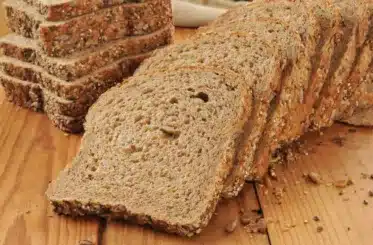 Slices of sprouted bread on a wood surface
