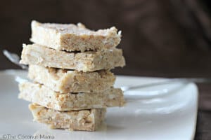Coconut crispy treats in a stack on a white platter