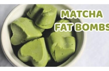A bowl filled with heart-shaped matcha fat bombs. The text reads, "Matcha fat bombs."