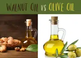 A jar of walnut oil set beside a basket of walnuts with a few whole and split walnuts scattered around. A jar of olive oil next to a few green olives.