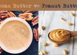 Top view of a bowl of pecan nut butter encircled by some unshelled pecan nuts. A spoon heaped with peanut butter, surrounded by a few peeled peanuts.