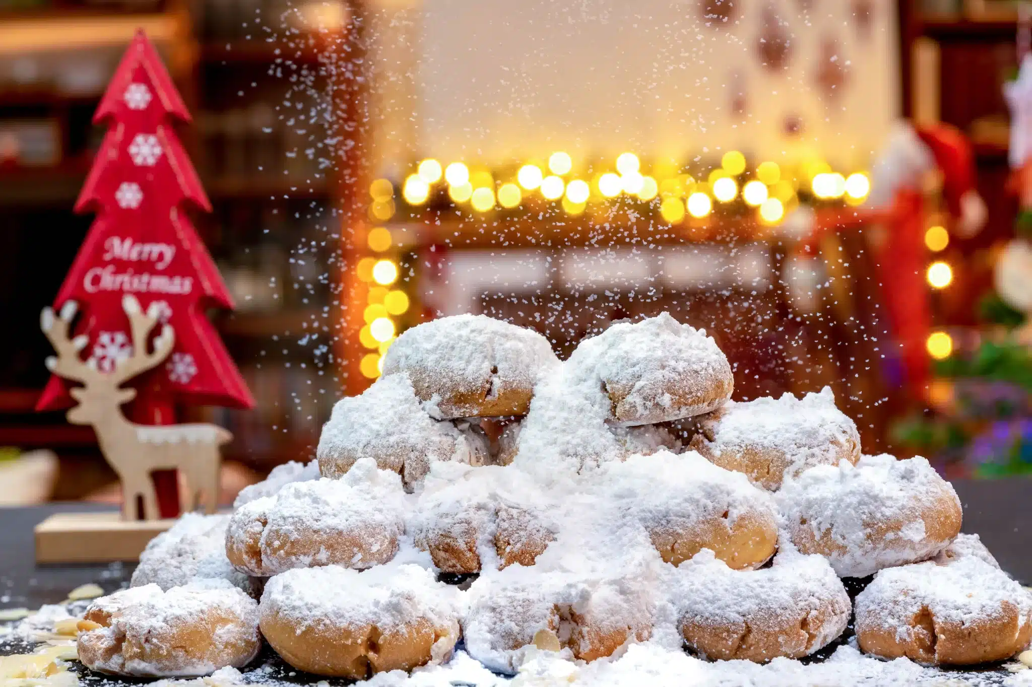 A Christmas background showcasing a pile of  kourabiedes.
