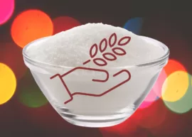A bowl heaped with sugar labeled with a dietary-fiber symbol.
