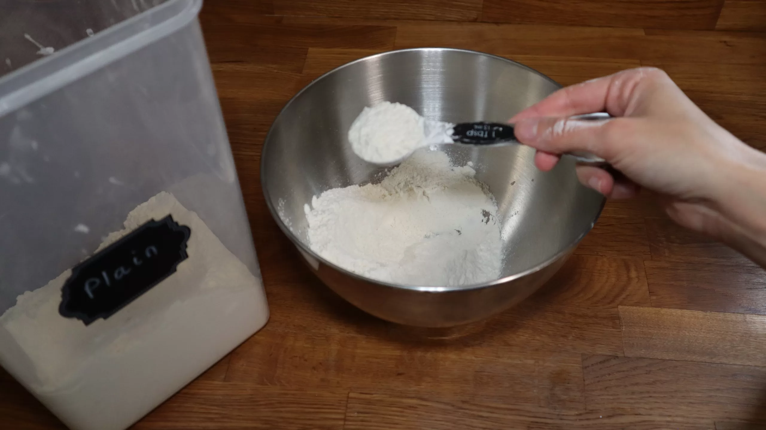 Measuring cornstarch out of flour. 