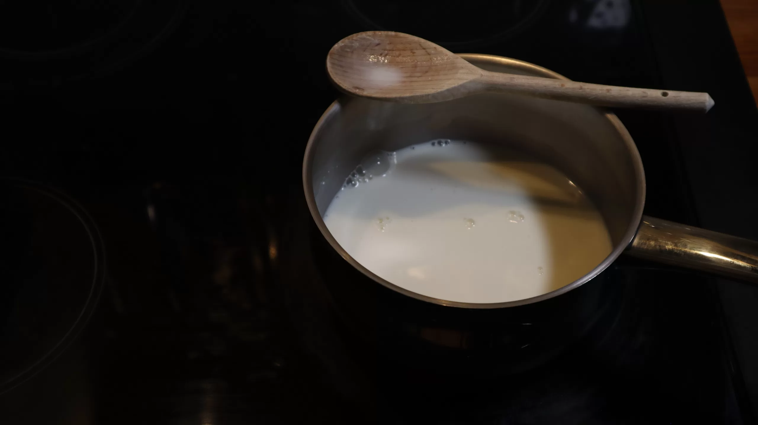 Evaporting milk in a saucepan.