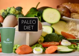 A paper cup from Panera Bread pictured with a variety of paleo-friendly choices.