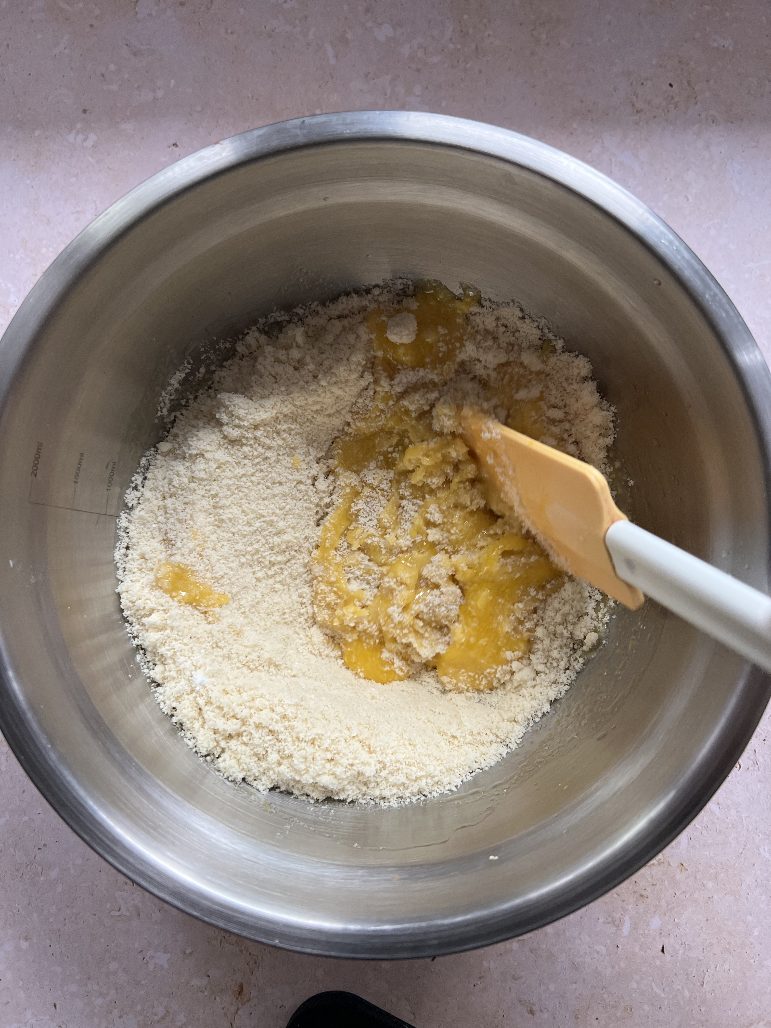 Overhead shot of the mixing of the dry ingredients with the wet.