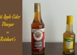 A pair of apple cider vinegar bottles, one produced by Reinhart's brand and the other by the Ponti brand.
