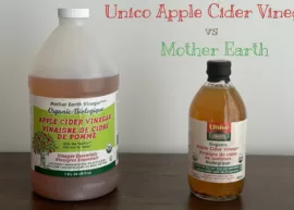 A 1.9 L container of Mother Earth apple cider vinegar and a bottle of Unico apple cider vinegar.