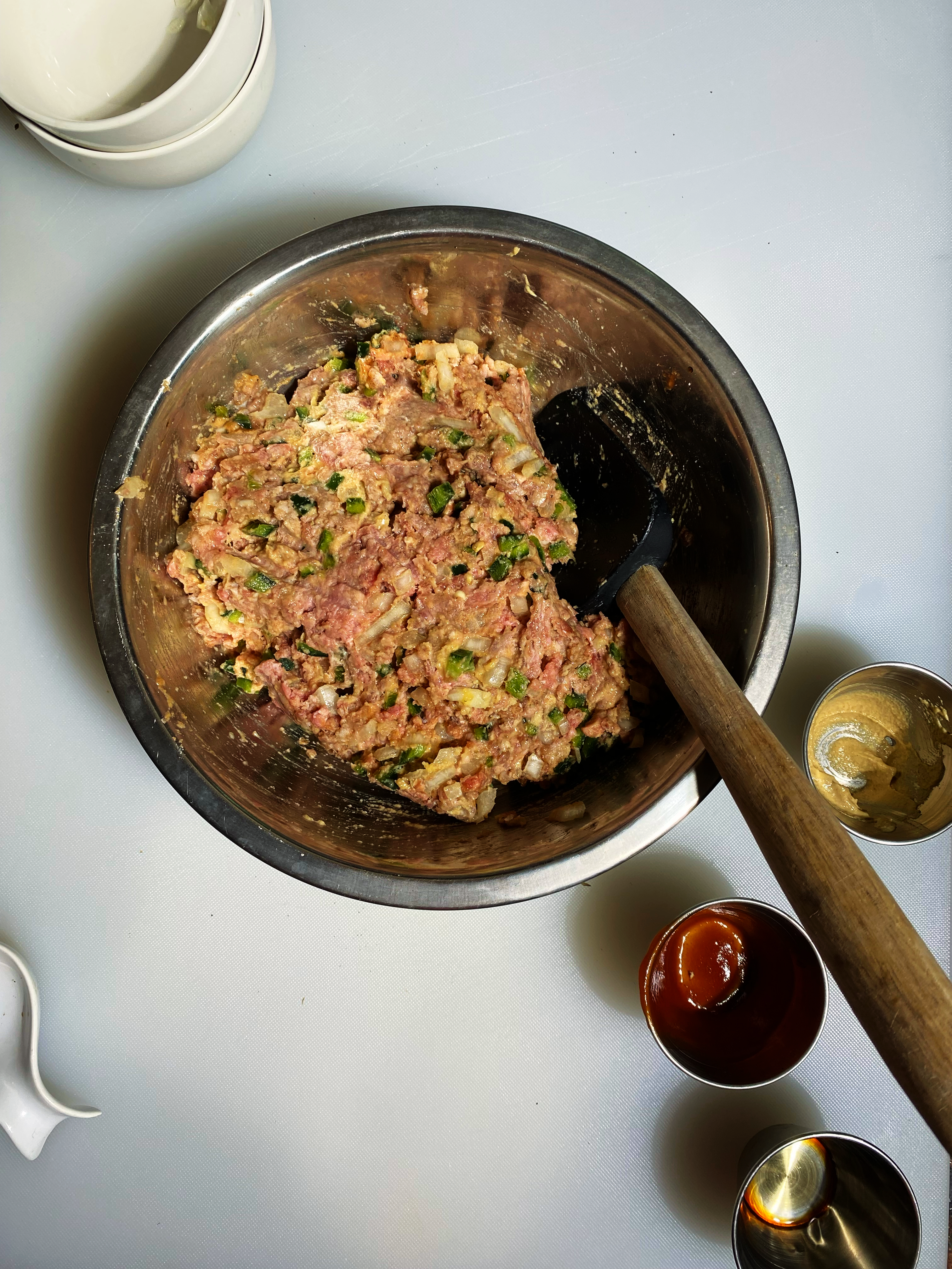 Overheat shot of the the meat mixed together with the vegetables, spices and condiments.