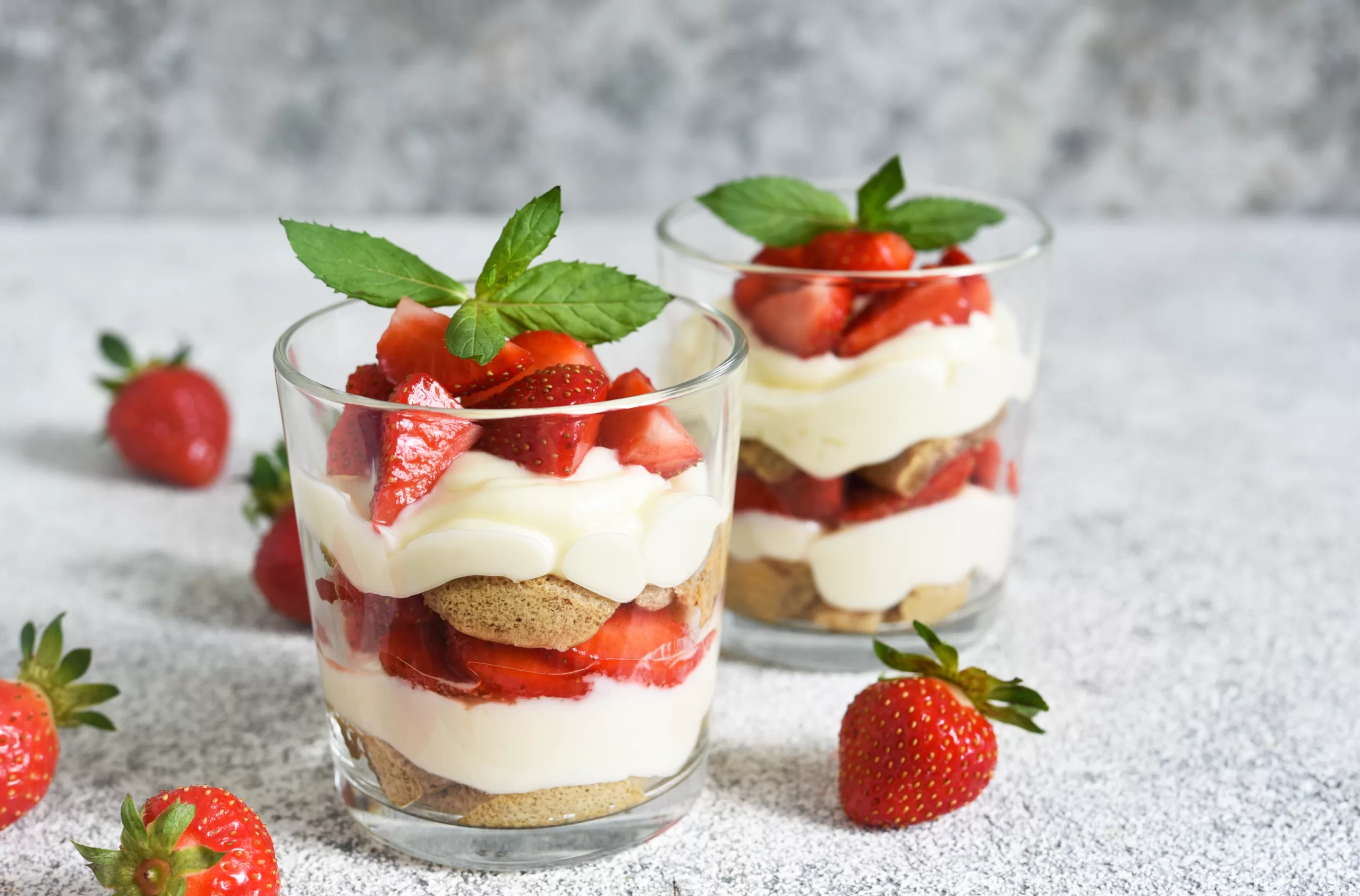 Two glasses of mouthwatering strawberry trifle. 