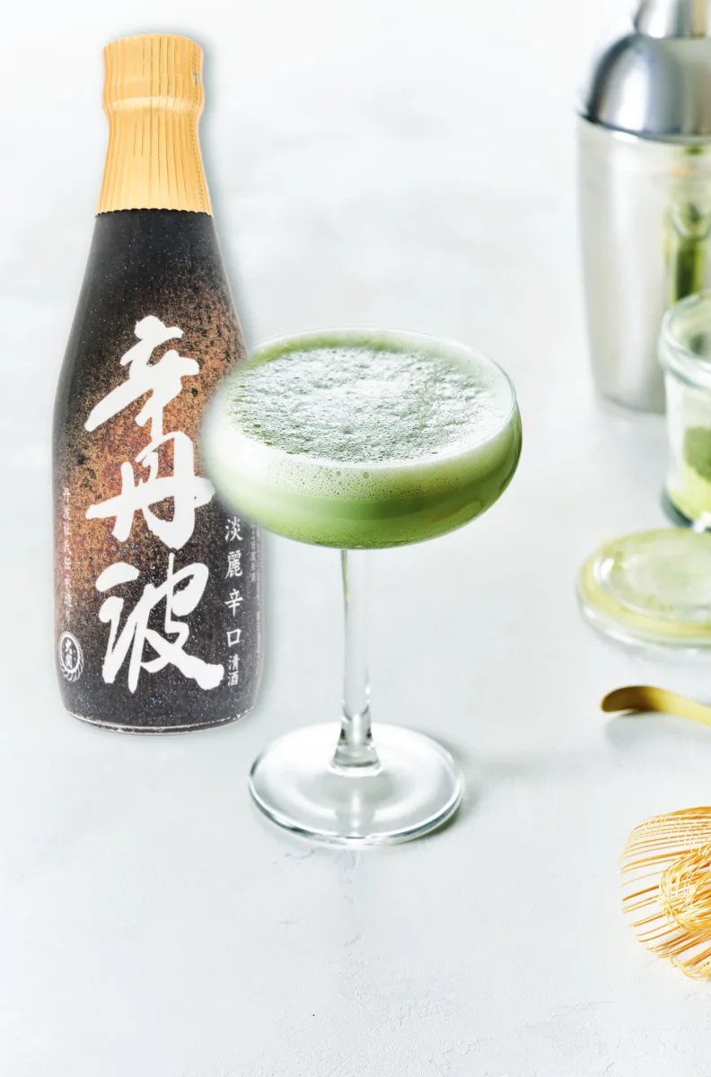 A cup of zen sake-tini, accompanied by a bottle of Ozeki traditional sake rice wine. 