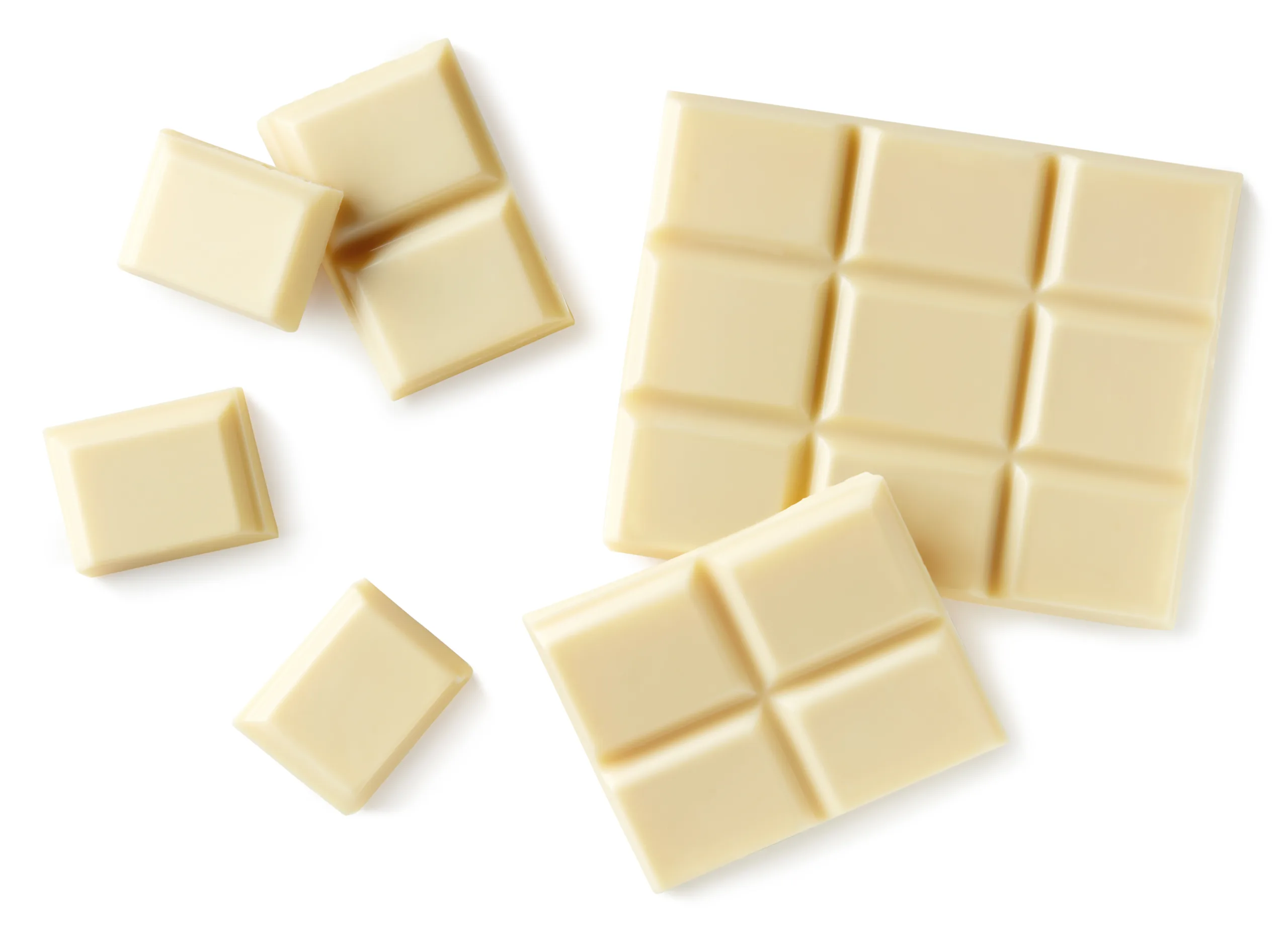 Top view of a plain surface showcasing white chocolate chunks.