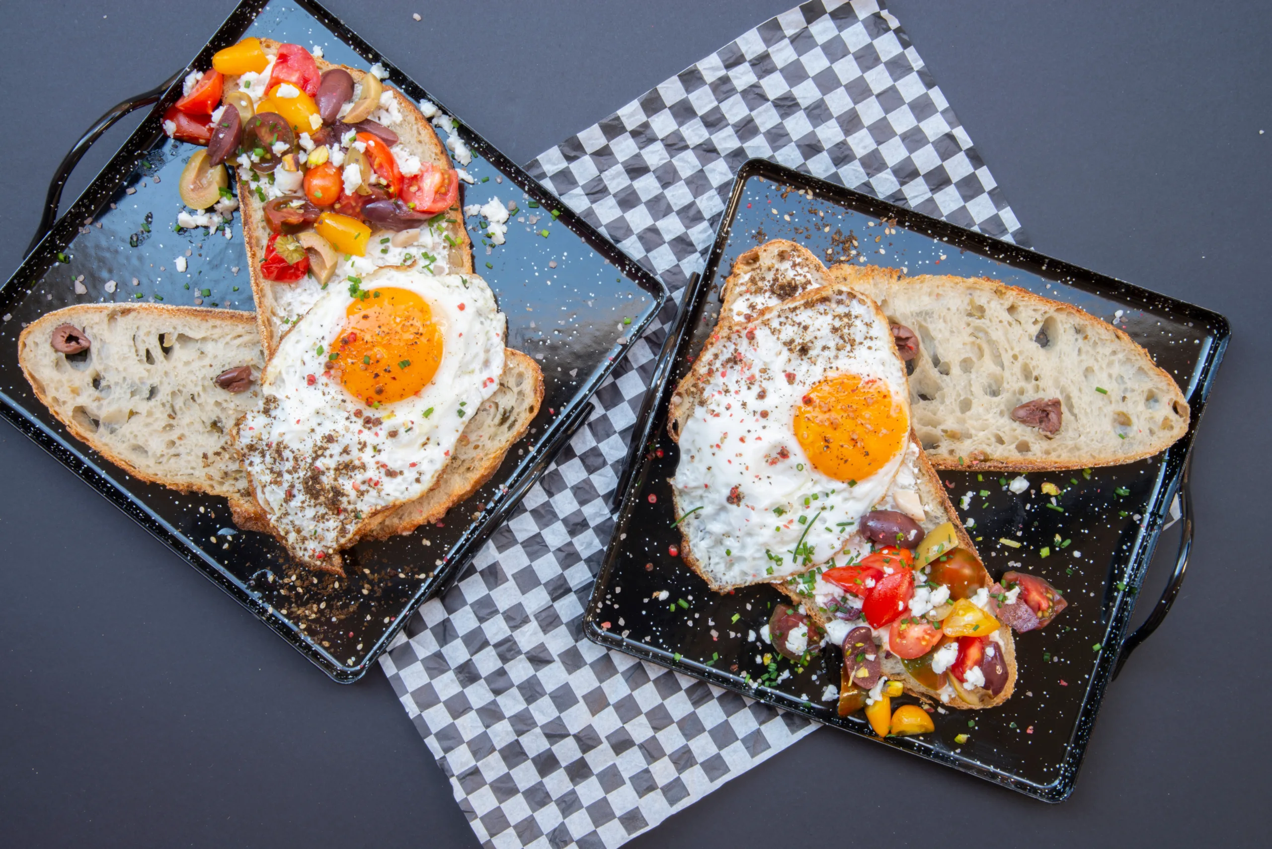 Top view of two portions of open-faced sandwiches with zaatar eggs.
