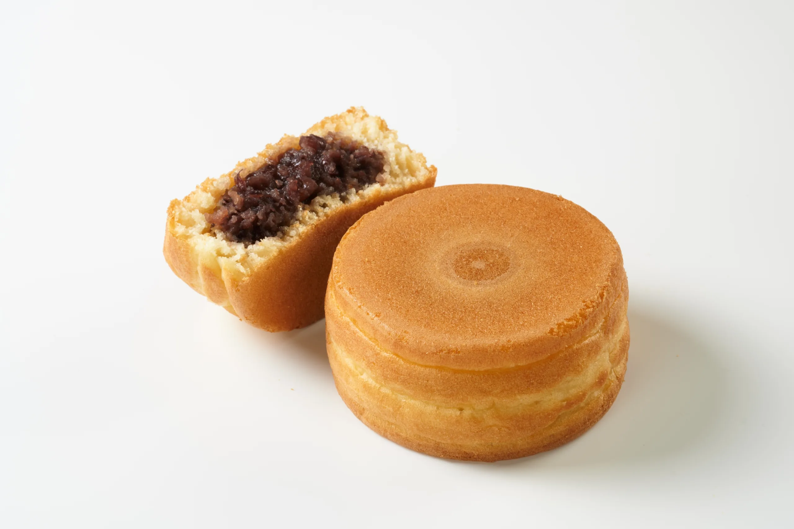 Wheel cakes resting on a white surface.