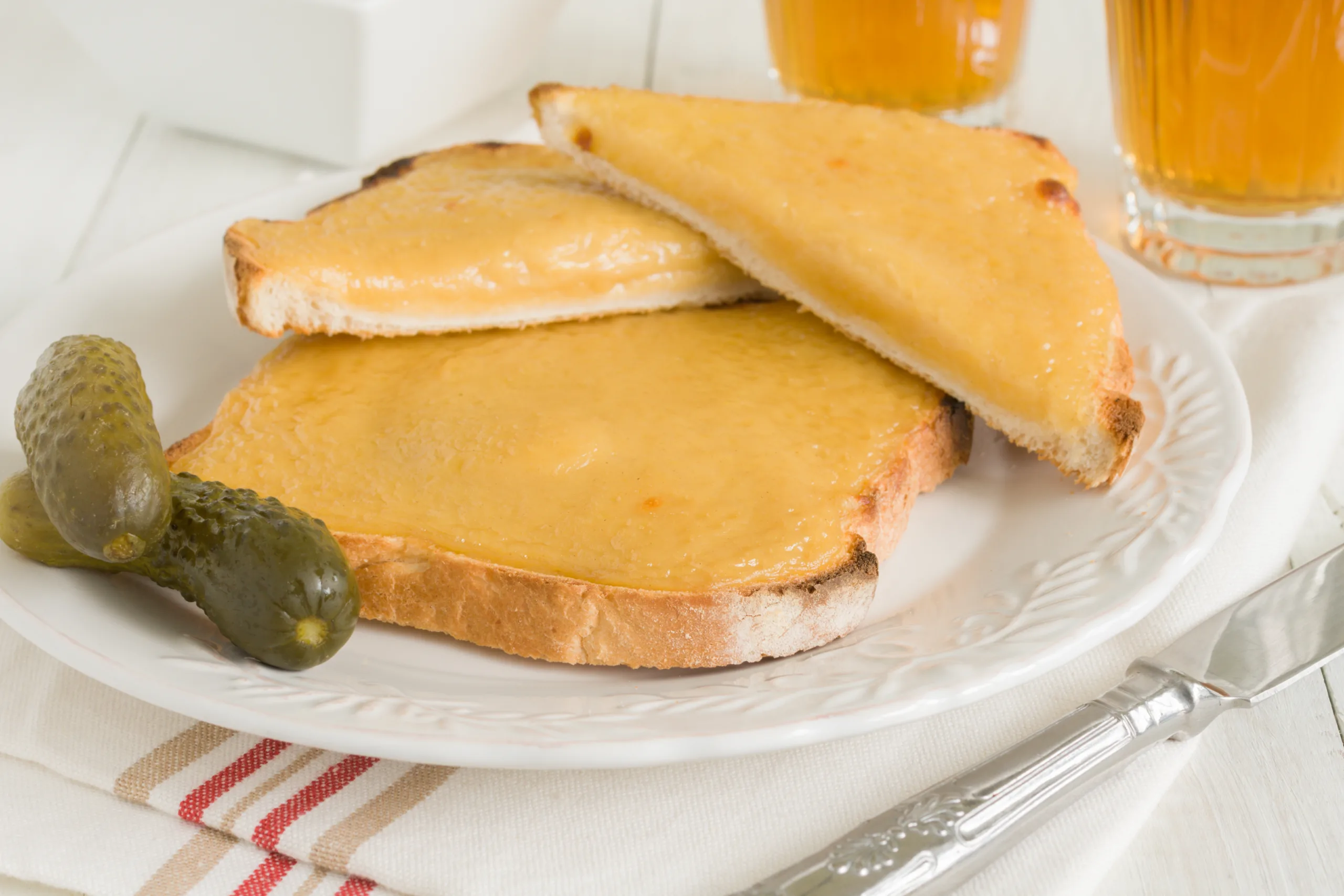 A portion of bread slices covered with Welsh cheddar cheese.