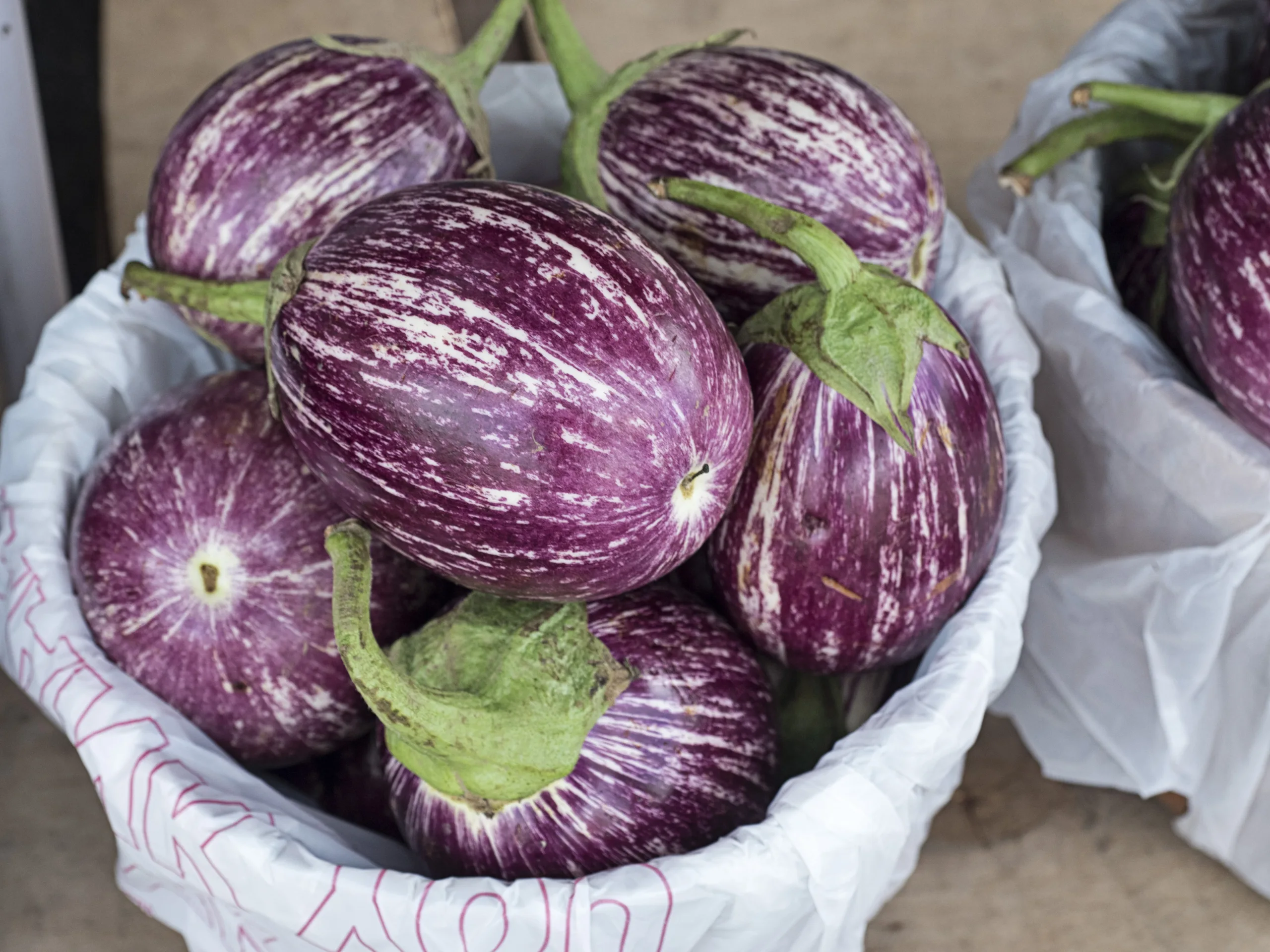 Zebra eggplants on sale on a market. 