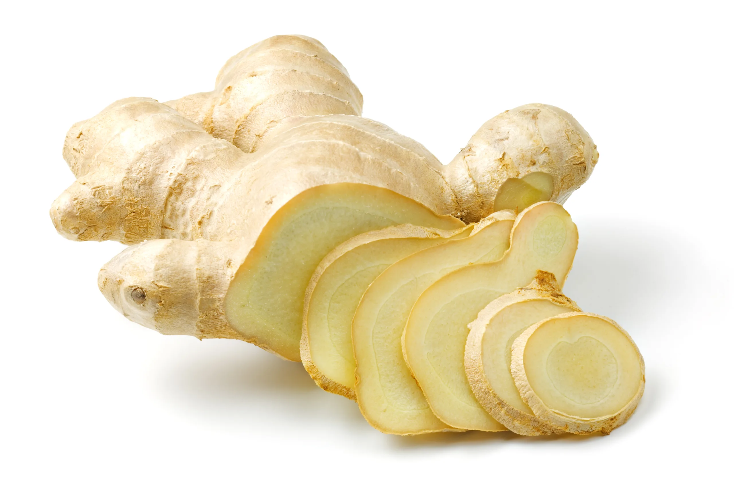 A partially sliced white ginger root.