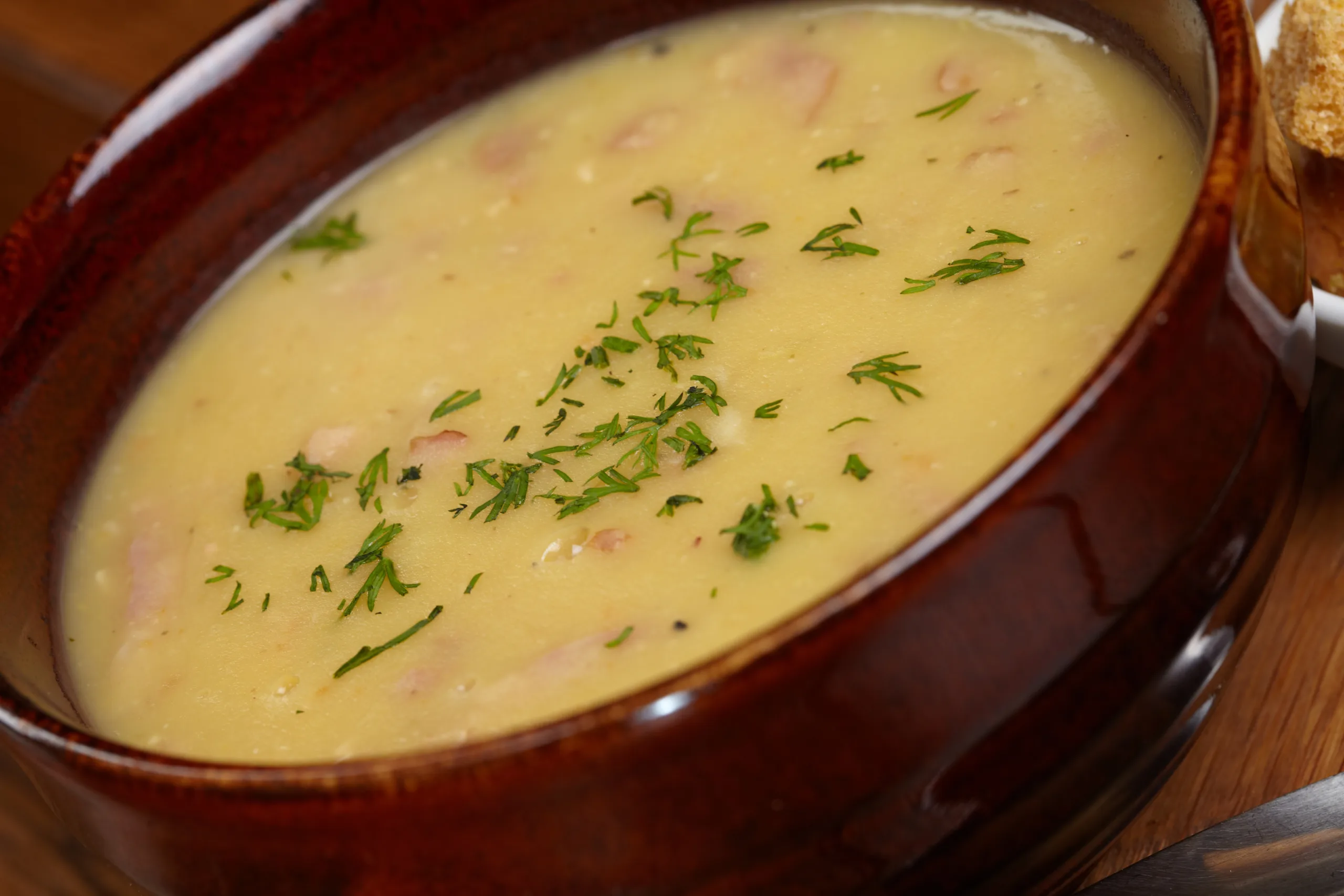 A close-up of a bowl of Wisconsin cheese soup.