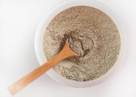 A wooden spoon in a bowl of Indian Healing Clay or Calcium Bentonite Clay.
