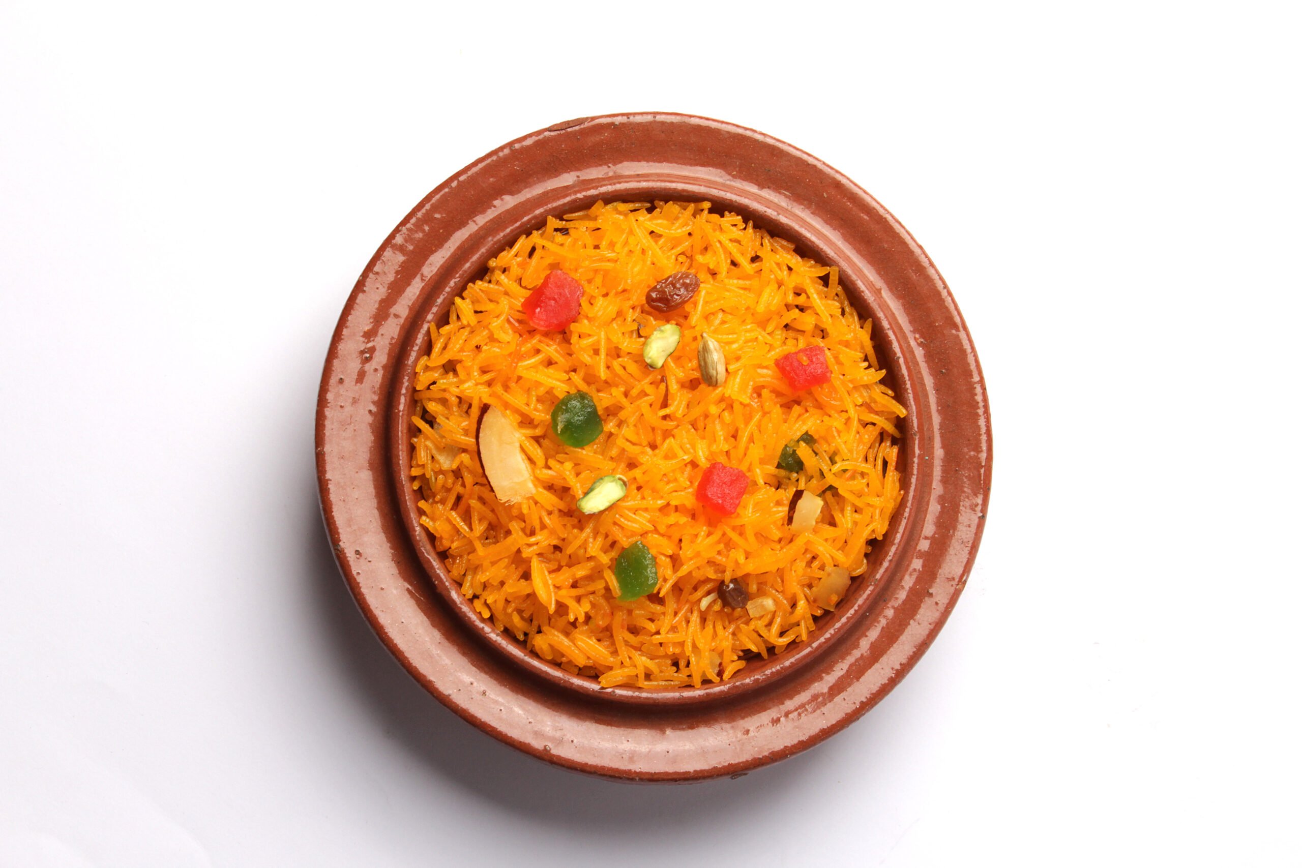 Top,View,Of,Zarda,Rice,,Indian,Sweet,Rice,Dish,In A single serving of zarda rice on a white background.