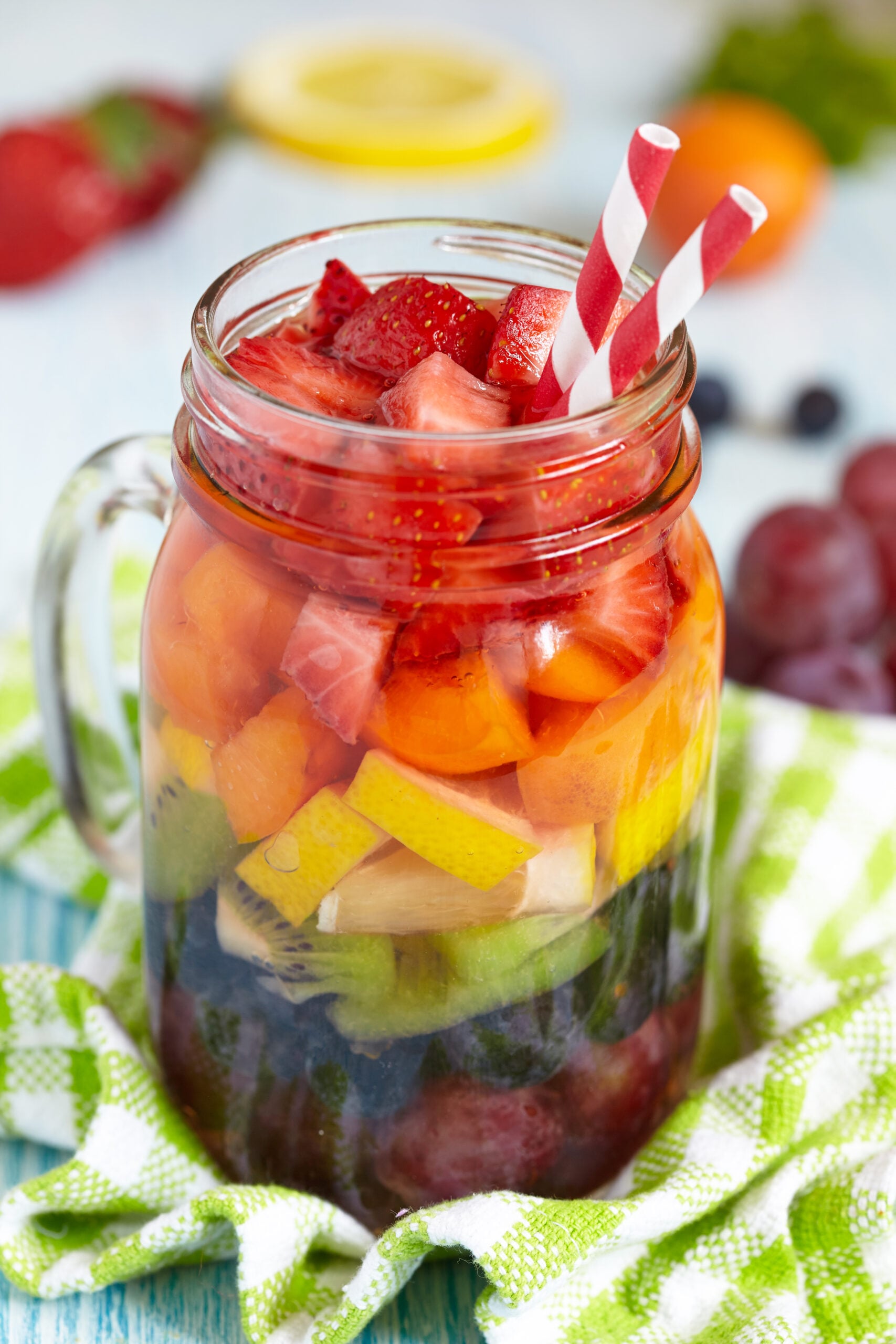 Fresh,Summer,Rainbow,Sangria,With,Colorful,Fruits,And,Berries Zoom-in image of a cup of rainbow sangria.
