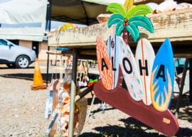 Sign with surf boards spelling out "Aloha"