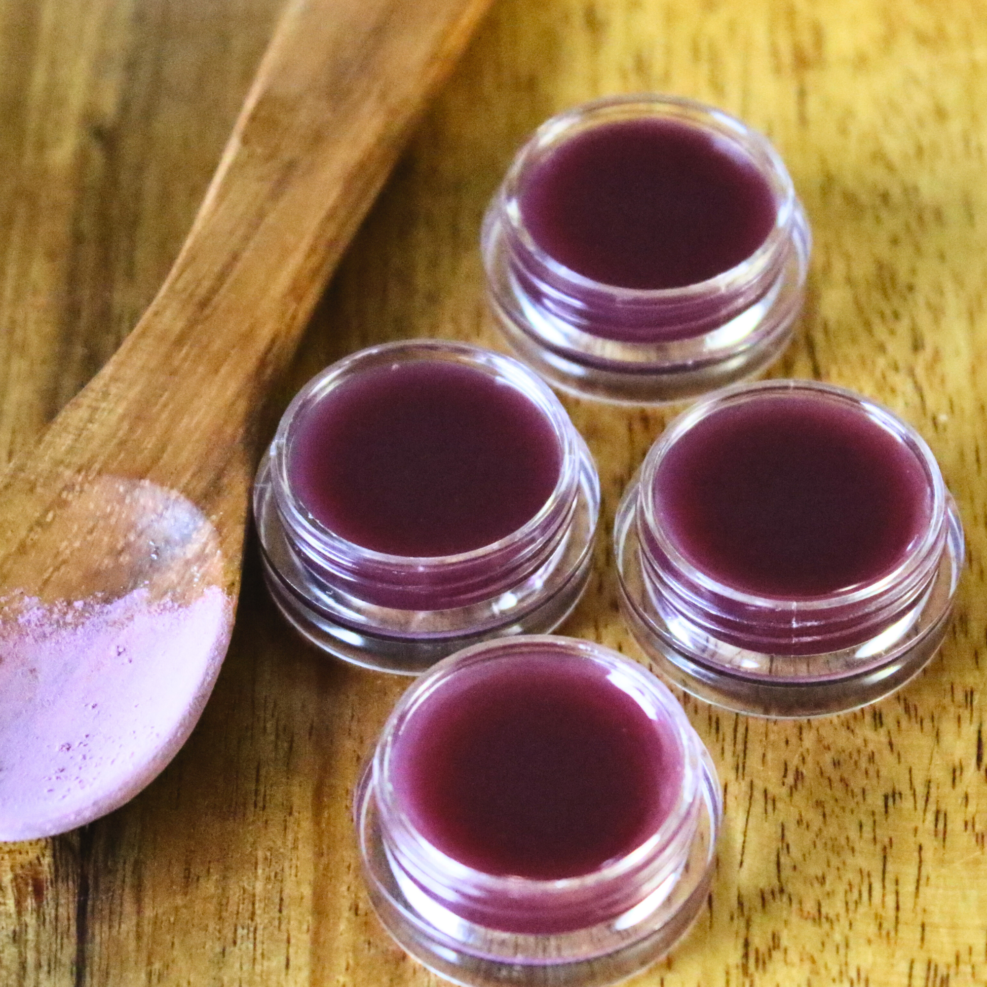 Homemade tinted lip balm with beet root powder.