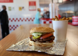 Five Guys burger and fries in a Five Guys restaurant.