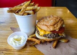 Five Guys fries with a cheeseburger and mayo.