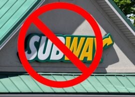 Subway restaurant sign with a "no" sign over it