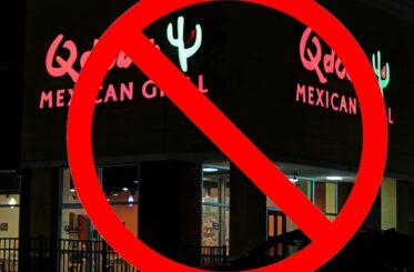 Qdoba Mexican Grill sign with a big red cancel symbol over it