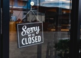Sign on door reads 'Sorry We're Closed'.