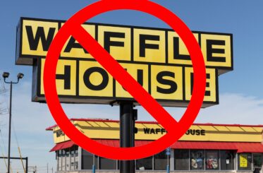 Waffle House sign with a big red "cancel" logo over it