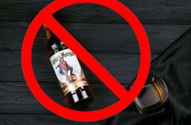 Bottle of Captain Morgan rum with a big red "cancel" sign over it