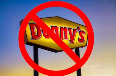 Denny's sign with a big "cancel" symbol over it