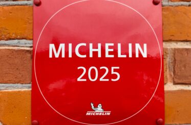 Michelin 2025 plaque on a brick wall