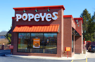 Popeyes restaurant with blue sky behind