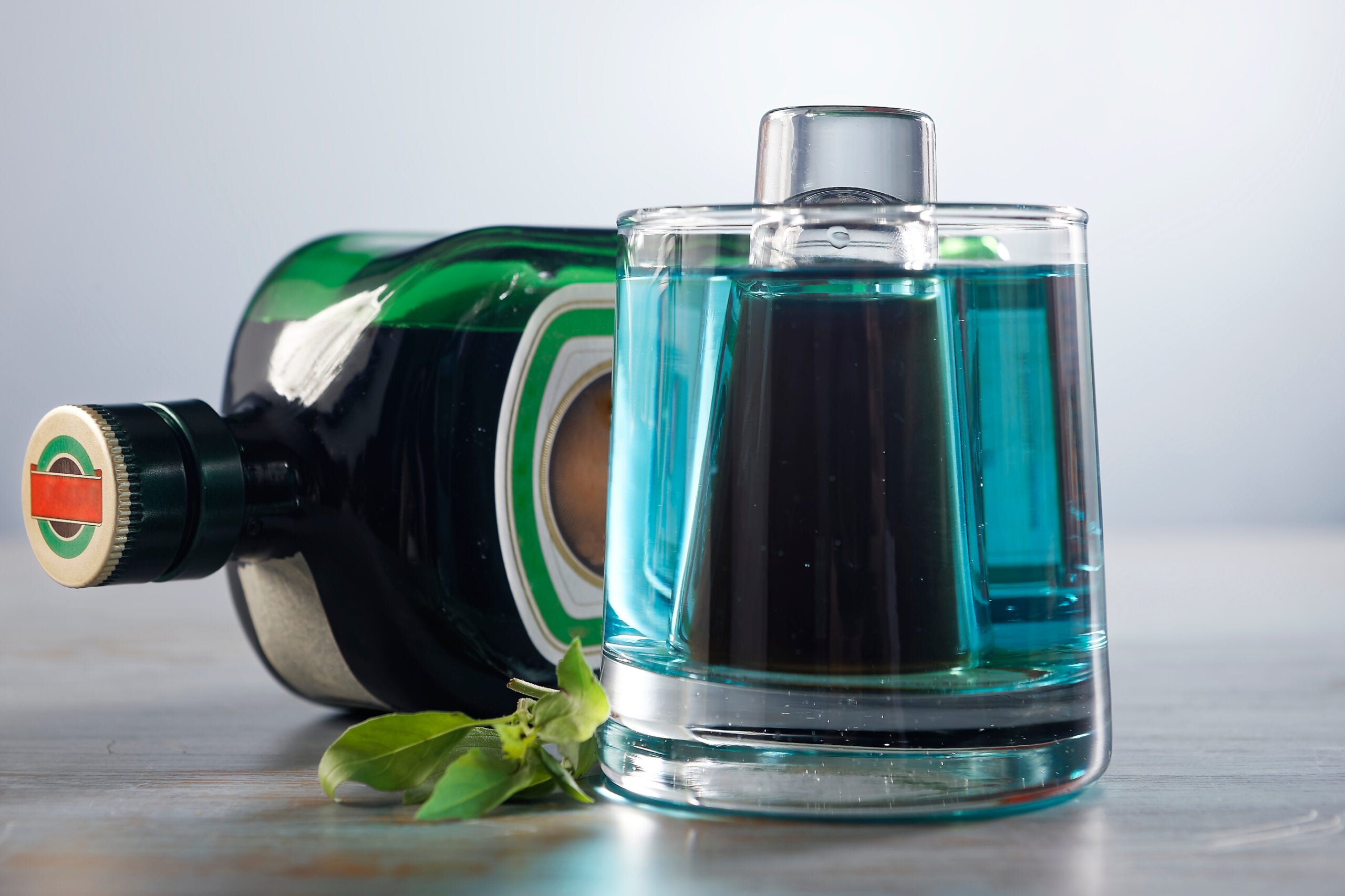 A Jägerbomb glass and a bottle of Jägermeister.