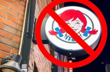Wendy's sign with a "no" sign over it.
