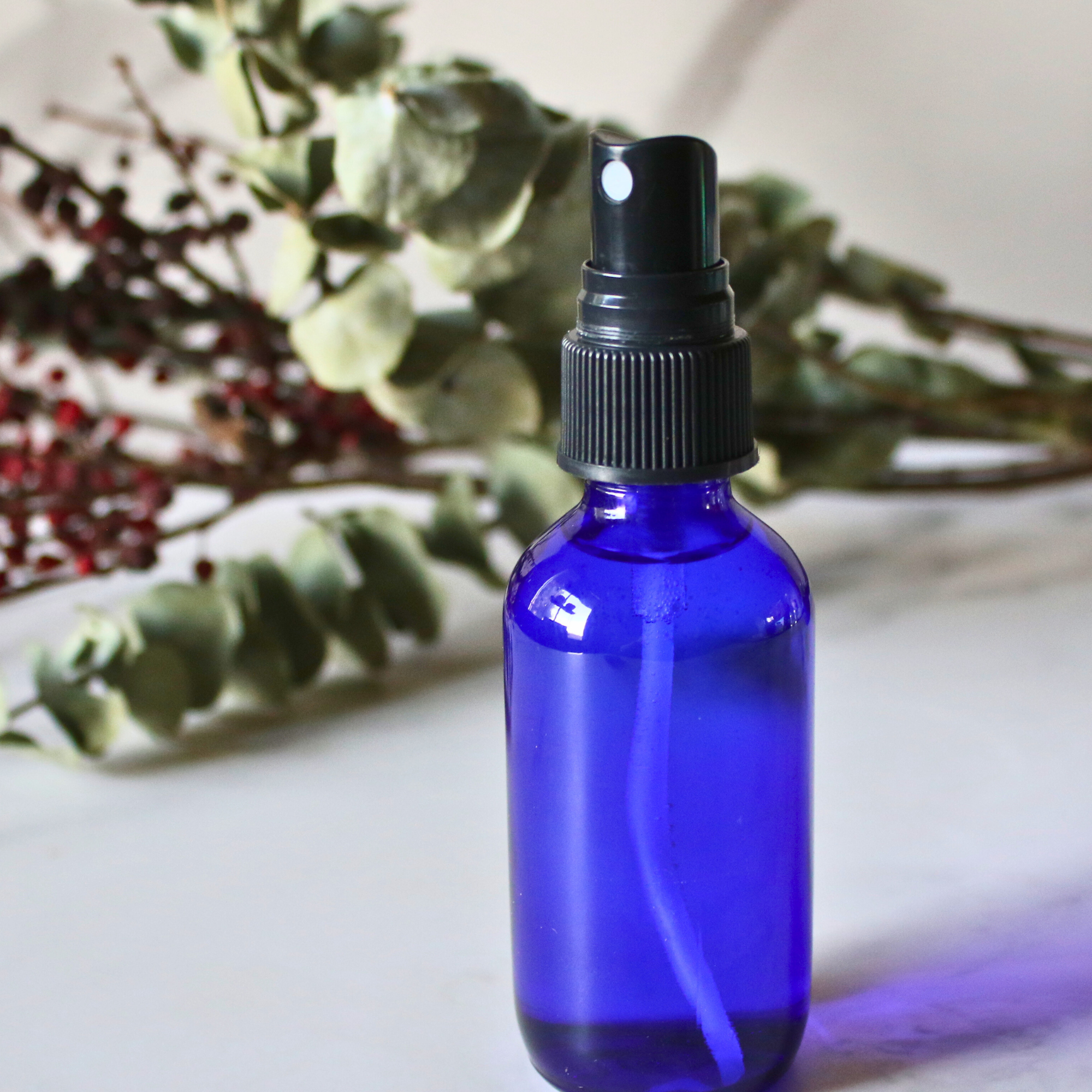 A spray bottle filled with homemade hair spray.