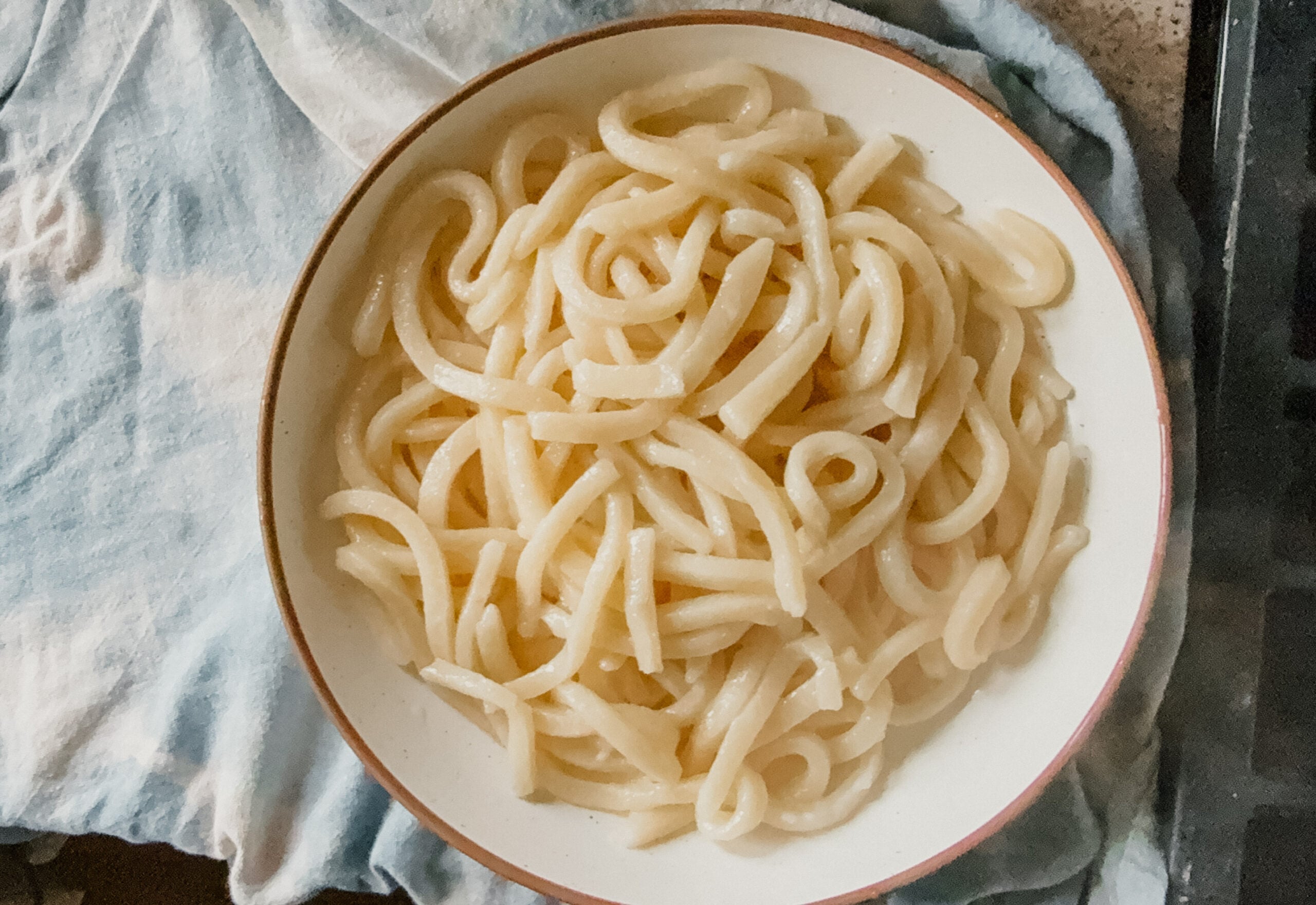 A bowl of freshly cooked noodles.