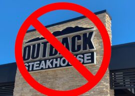 Outback Steakhouse sign with a big red cancel symbol over it