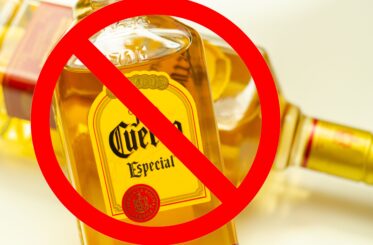 Bottle of Jose Cuervo with a big red cancel sign over it