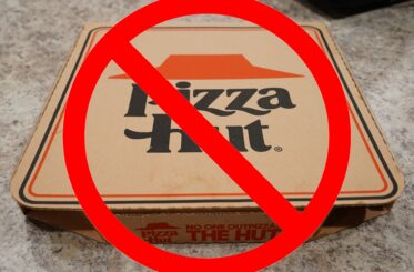 Pizza Hut box with a big red cancel sign over it