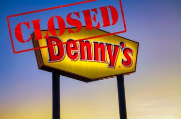 Denny's sign with a big "closed" stamp over it