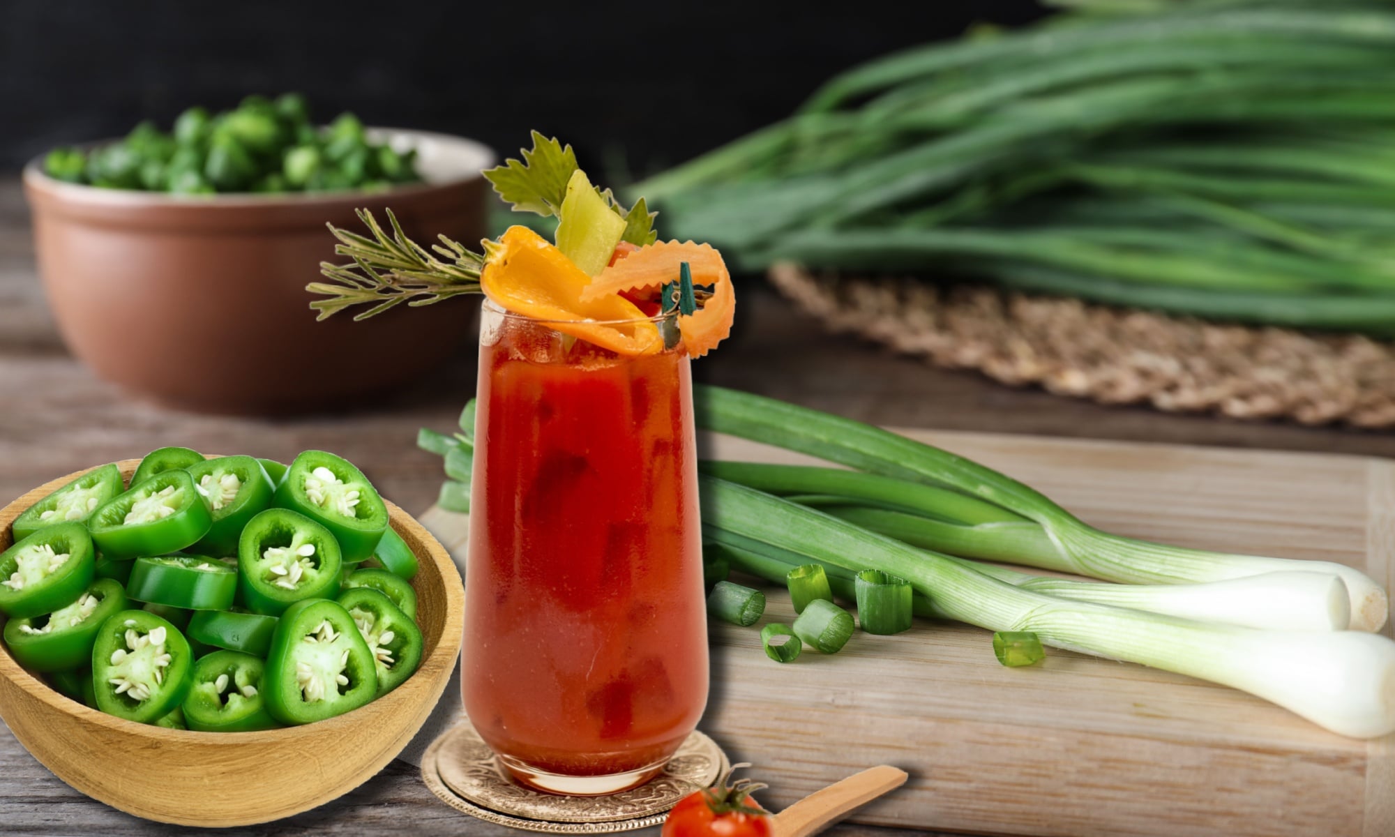 A glass of freshly made Ultimate Bloody Mary with some of its components. 