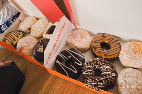 Dunkinโ has a glow-in-the-dark Halloween bucket filled with 50 Munchkins