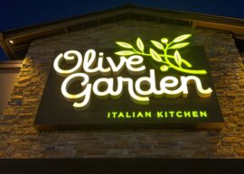 Olive Garden Italian Kitchen sign lit up at night on building