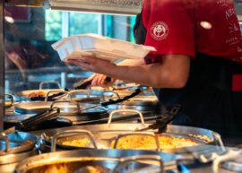 Panda Express worker putting food in container